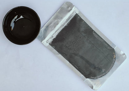 Black Glaze Stain in a sealed packet with a black bowl 
