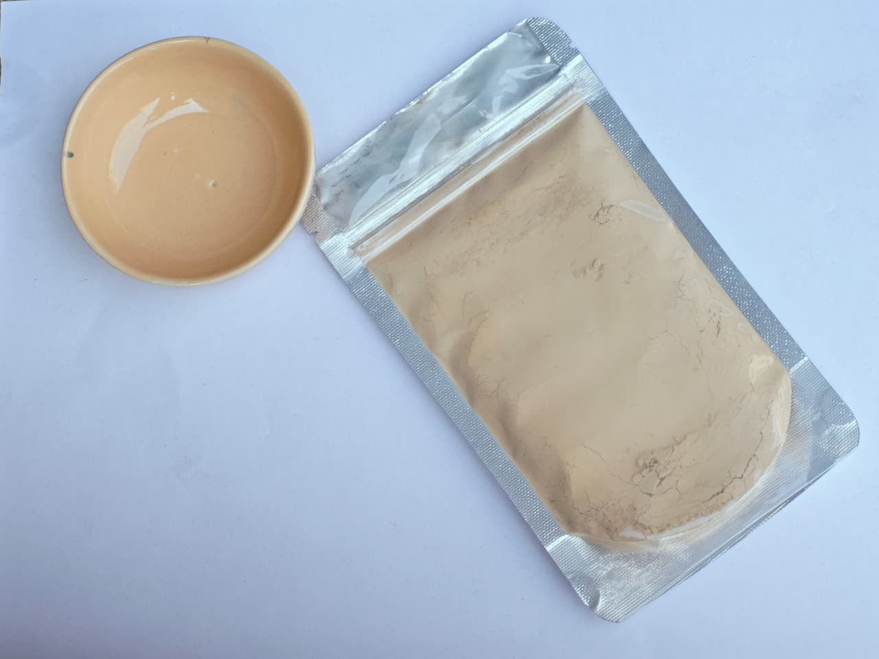 Ivory Glaze Stain in a sealed packet with a Ivory bowl