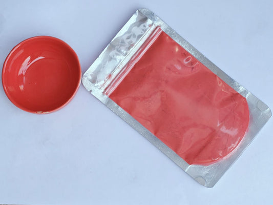 Red Glaze Stain in a packet with a red bowl