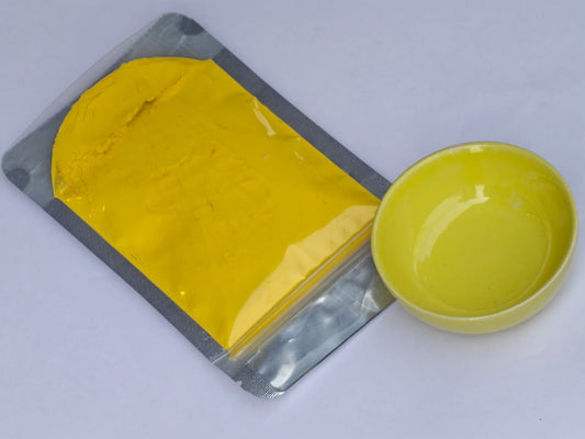 Yellow glaze in a sealed packet with a bowl of that colour