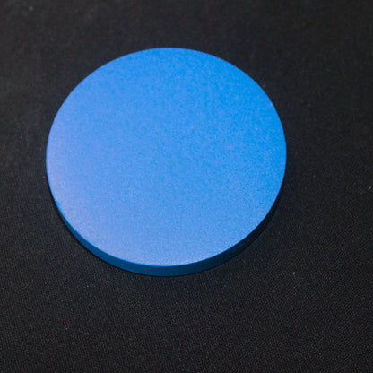 A disc shown in the picture displaying the actual color of the clay