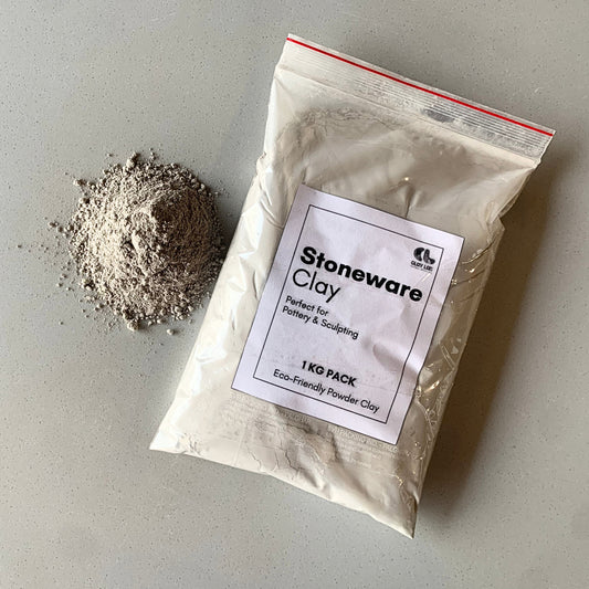 A plastic bag of 1kg stoneware clay with its pile on the side