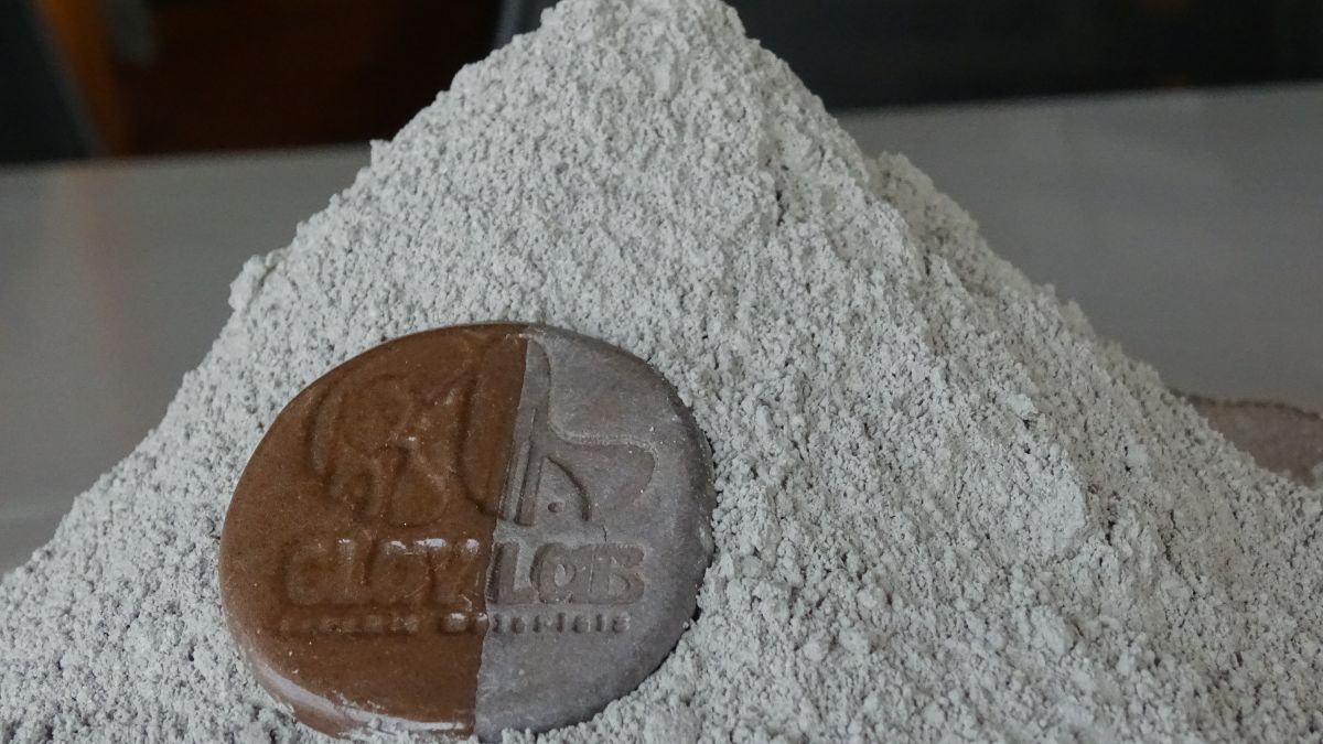 zoomed in photo of dark brown stoneware clay powder showing its texture