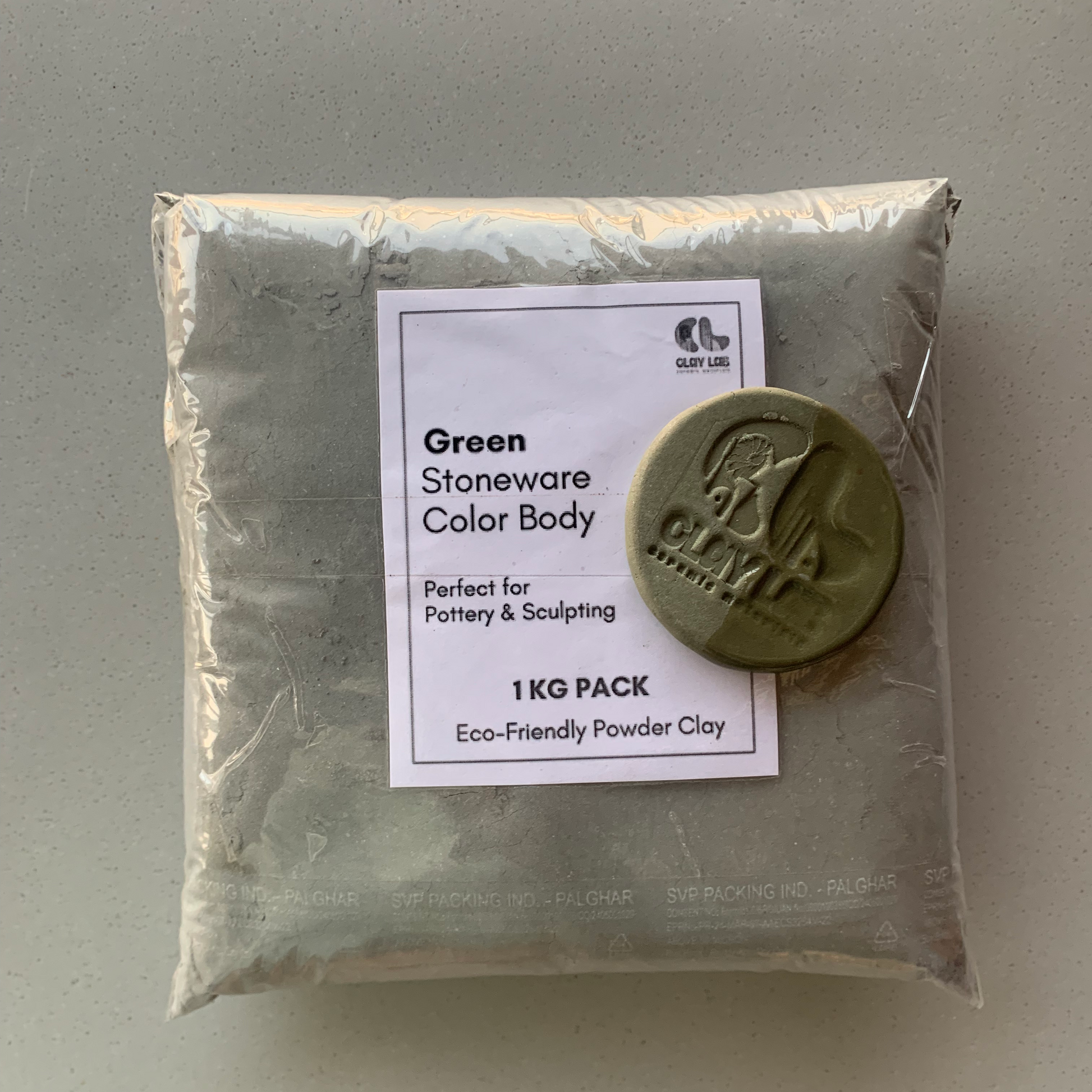 A 1 KG pack of green stoneware color body powder clay, with a label on the front.