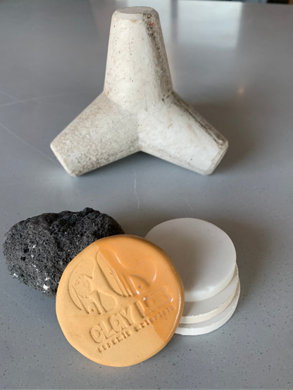 A photograph showing different forms of a stoneware clay body for sample