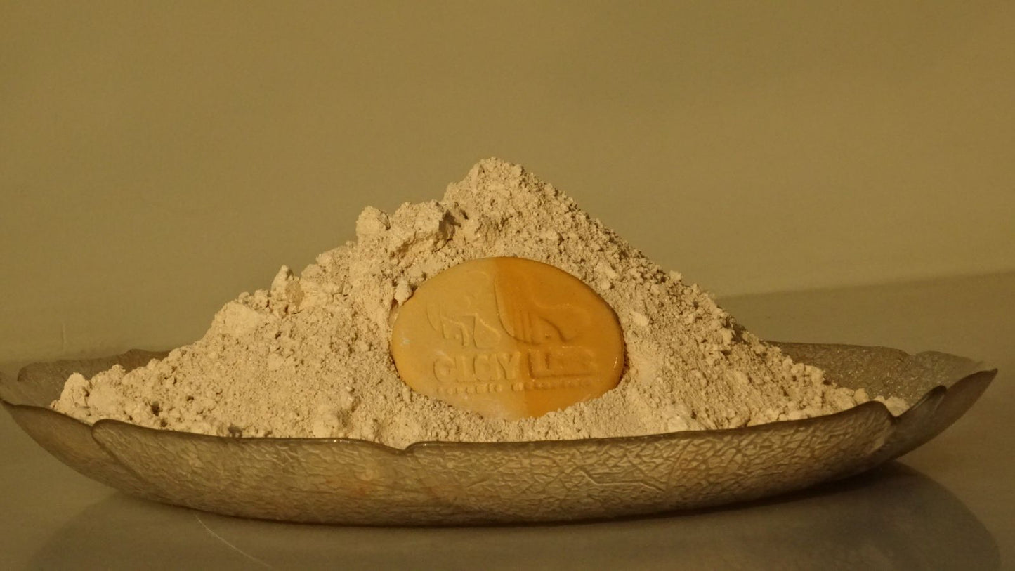 orange clay powder in a plate shown from the side angle