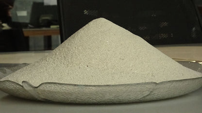 pile of terracotta grog 100 mesh granules in side view