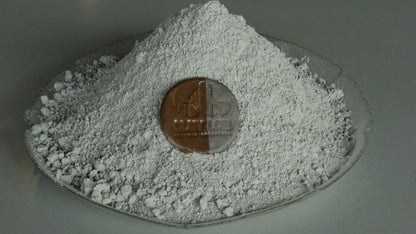 dark brown clay in a bowl with a coin showing its actual colour