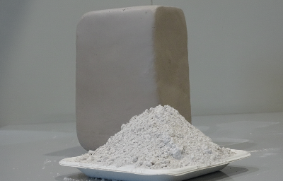 white stoneware clay powder with its solid stone shaped block